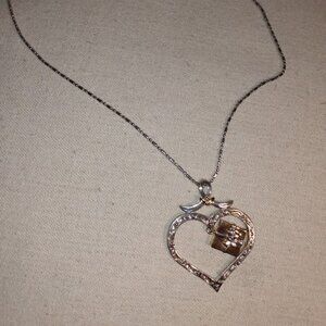 Gift in heart pendant necklace.